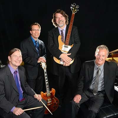 Photo of the Brubeck brothers with their instruments