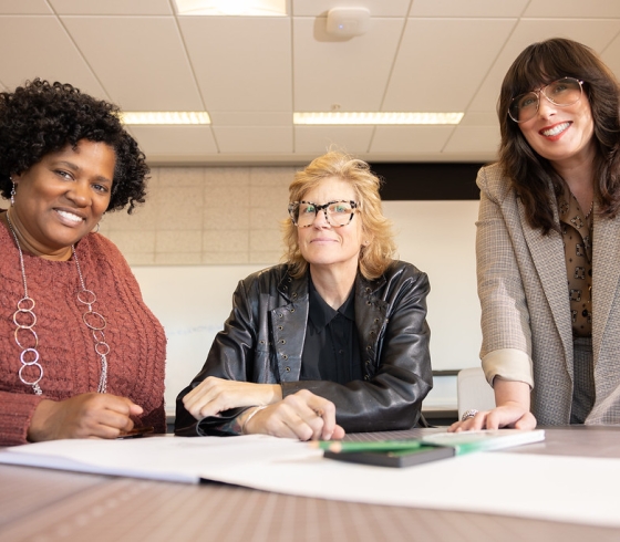 Shantell Reid, student Lisa SiemerHarvey and Erin Habes from Buffalo State's fashion and textile technology program.
