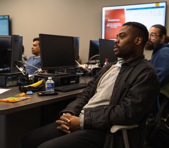A group of participants sit in a PPDI session 