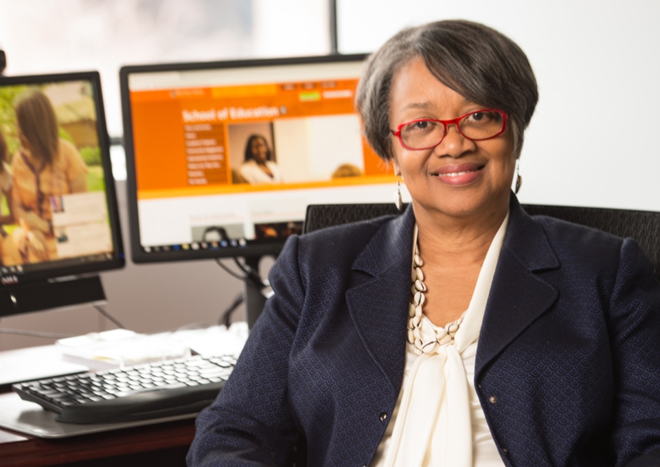 President Conway-Turner in her office in front of computer monitor