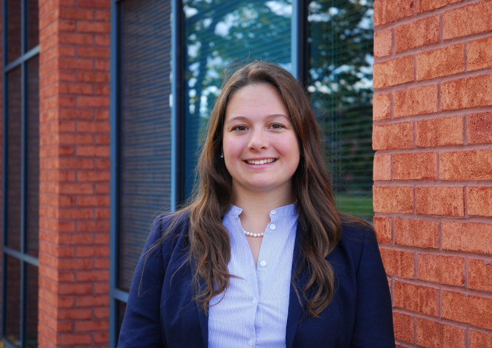 Madeline Kromerstanding in front of brick building
