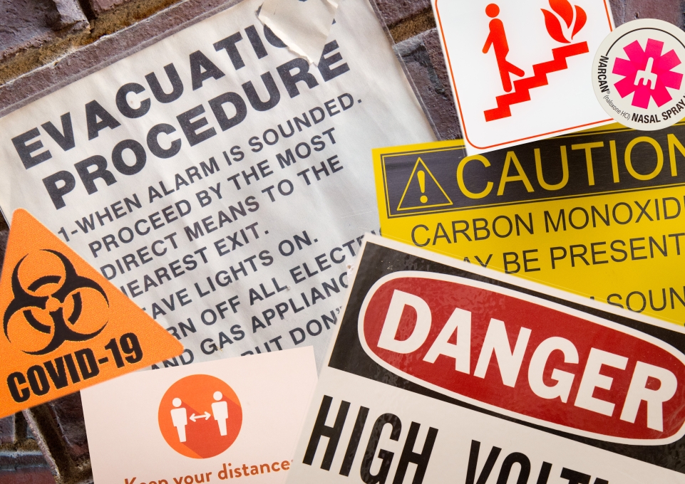 Montage of caution, danger, and hazard signs