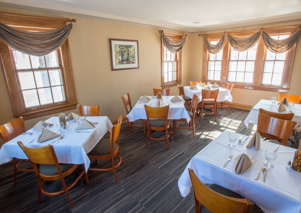 Interior dining area of Campus House showing tables with place settings