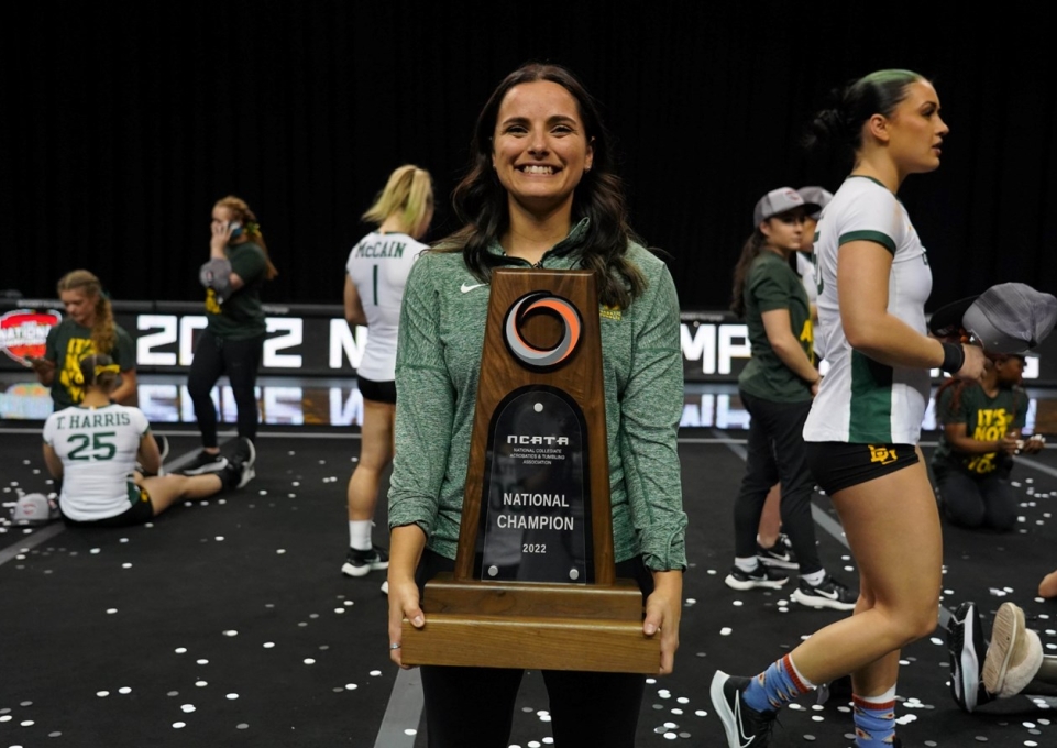 Alia Stark holding the National Championship trophy