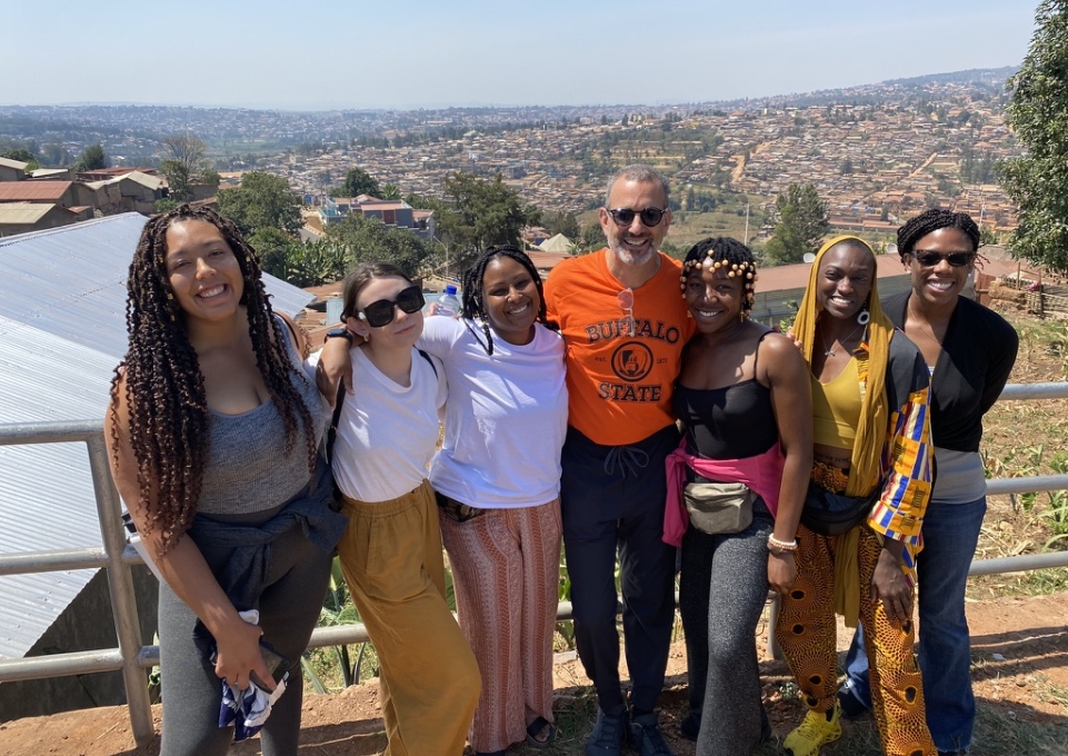 Rwandan visitors a pose on an overpass