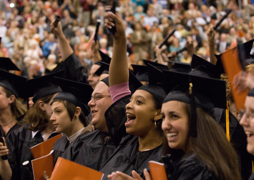 Group of happy graduates in theior caps and gowns