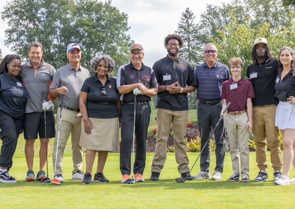 Group of golfers posing for a photo at the tournament