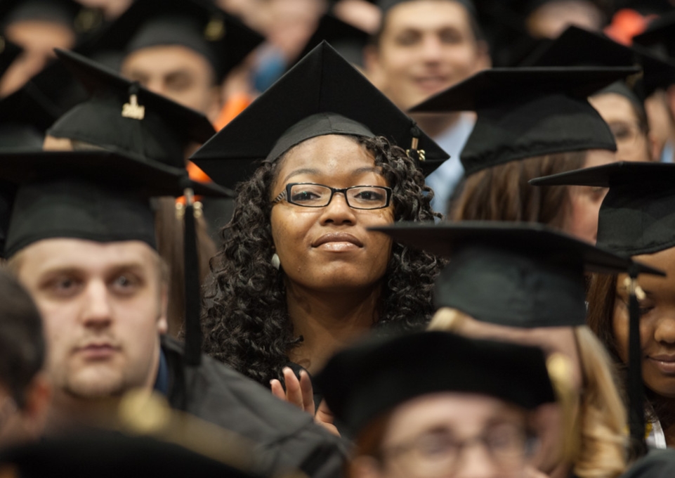 Closeup of students in their caps and gowns at commecement