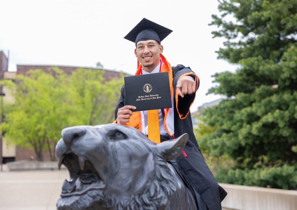 Student in a graduation cap and degree
